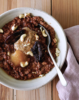 Creamy Cacao & Cashew Oat Porridge with Caramelised Dates